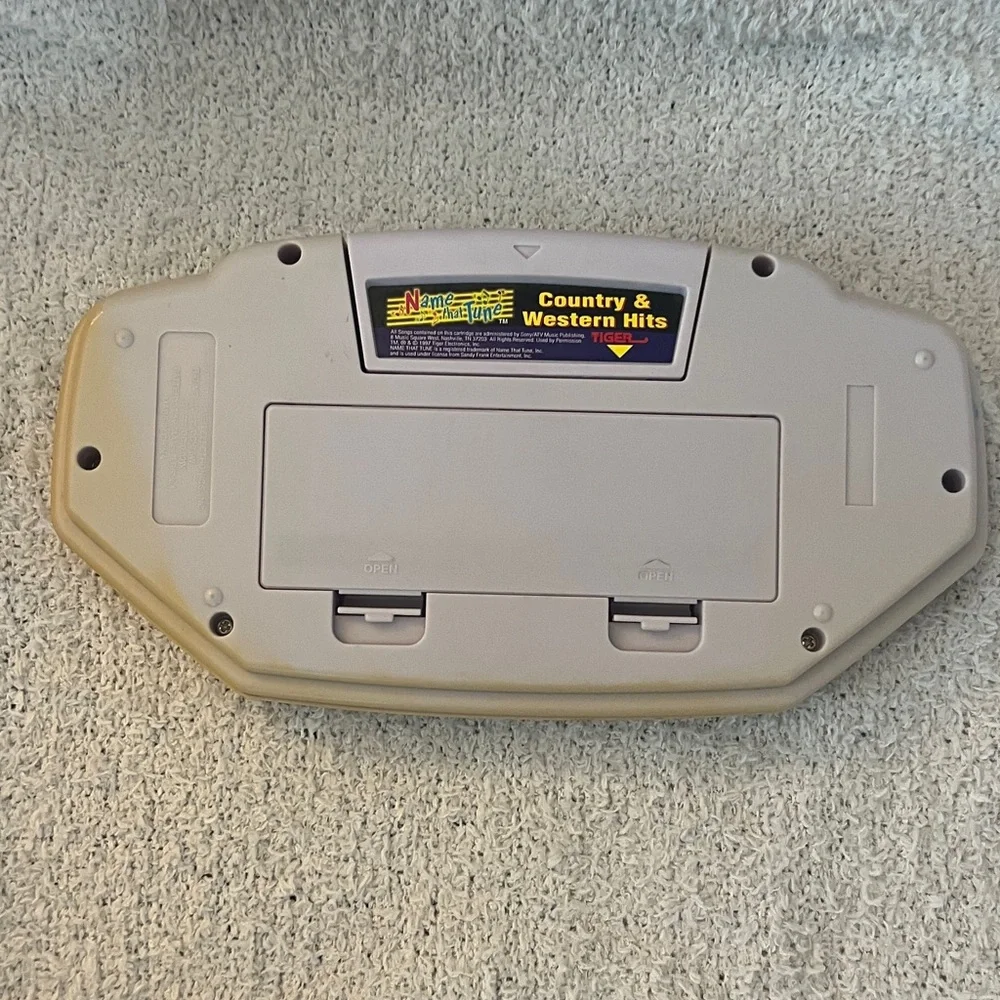 Name That Tune Handheld Game with country and western hits game Tiger toy